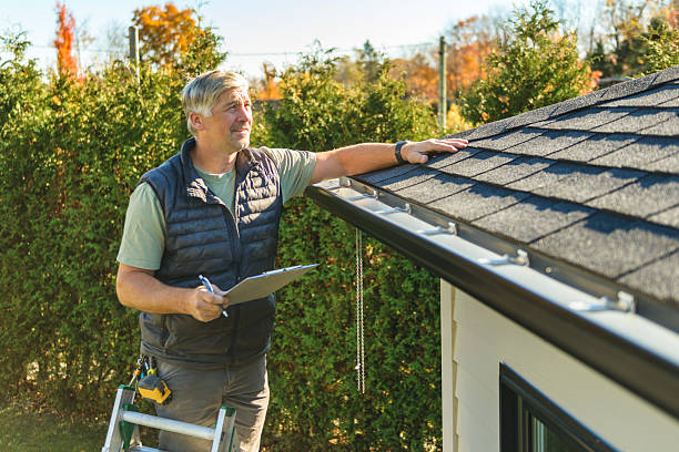 Professional Roofing technician working in Earlham, IA